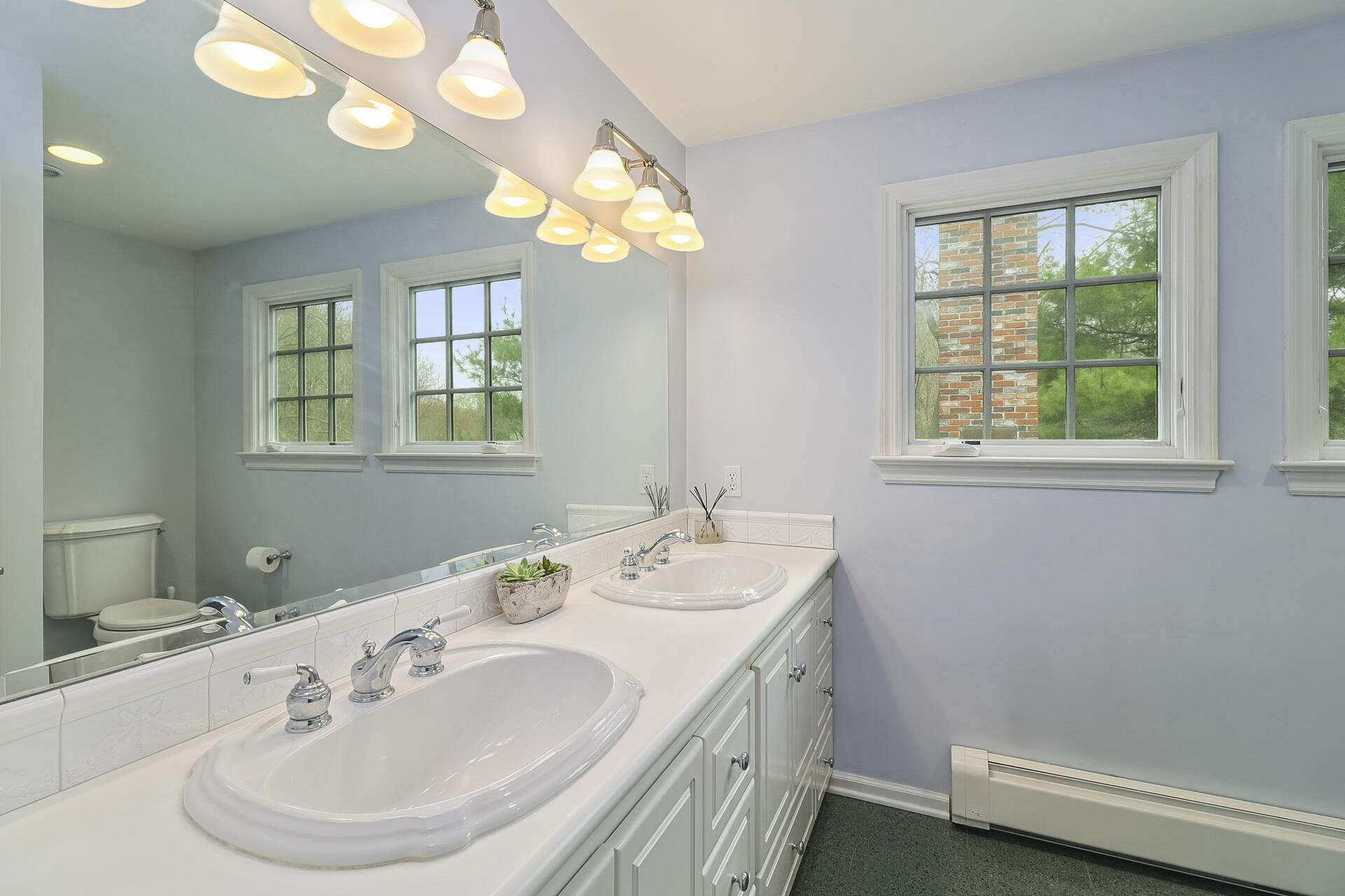 37 Red Rose Circle Darien, CT 06820 - Photo 20 of 40 a bathroom with a sink and a mirror