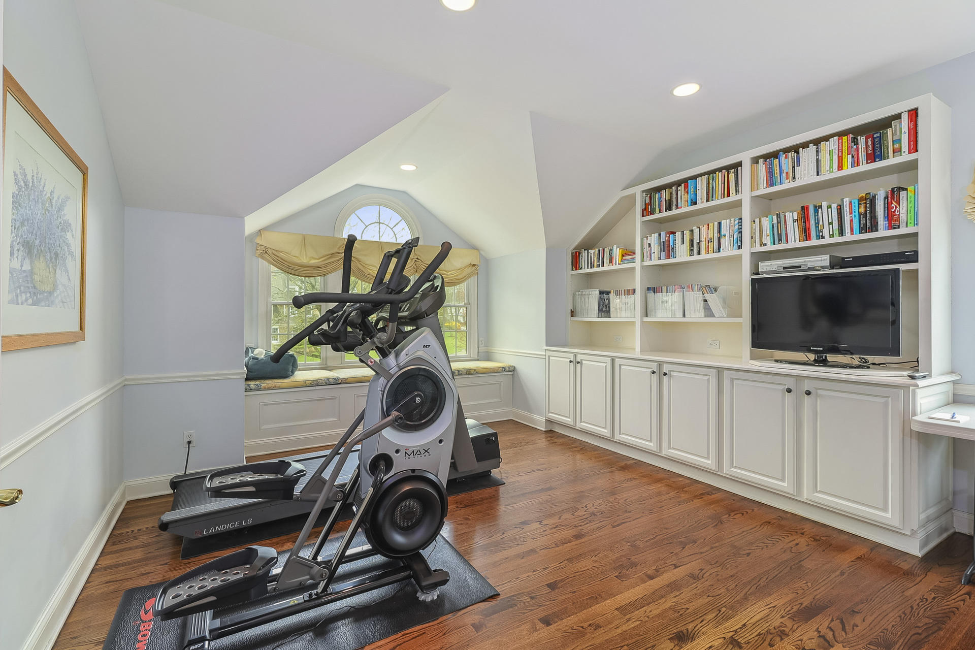37 Red Rose Circle Darien, CT 06820 - Photo 22 of 40 a view of a workspace with furniture and a bookshelf