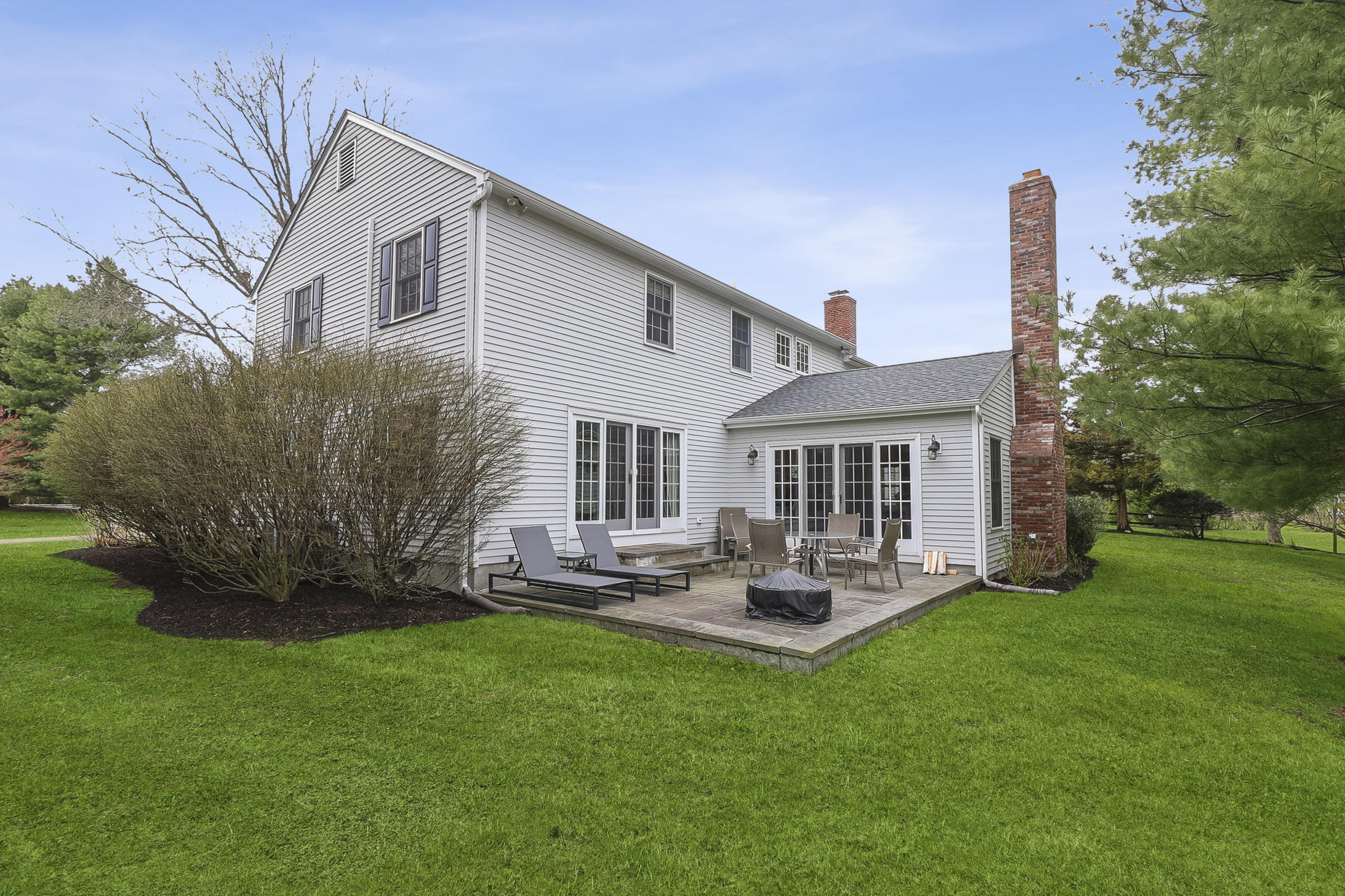 37 Red Rose Circle Darien, CT 06820 - Photo 35 of 40 a front view of a house with garden