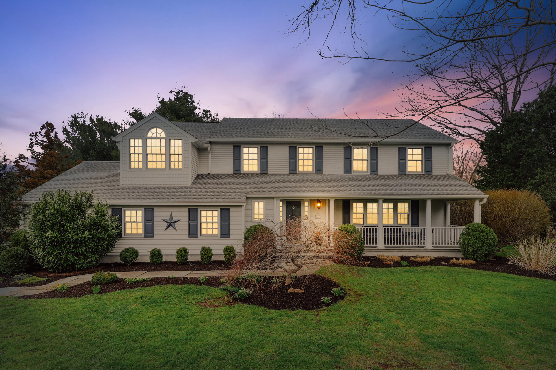 37 Red Rose Circle Darien, CT 06820 - Photo 37 of 40 a front view of a house with a yard and outdoor seating