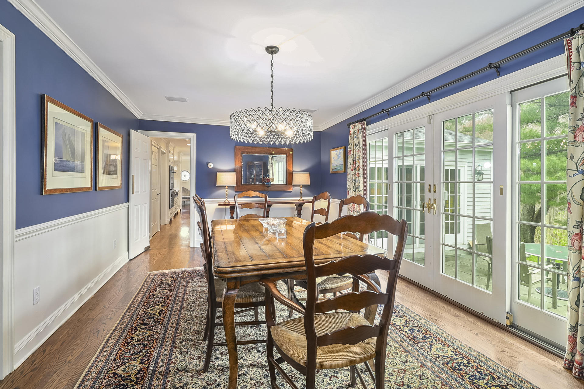 37 Red Rose Circle Darien, CT 06820 - Photo 6 of 40 a view of a dining room with furniture wooden floor and a chandelier
