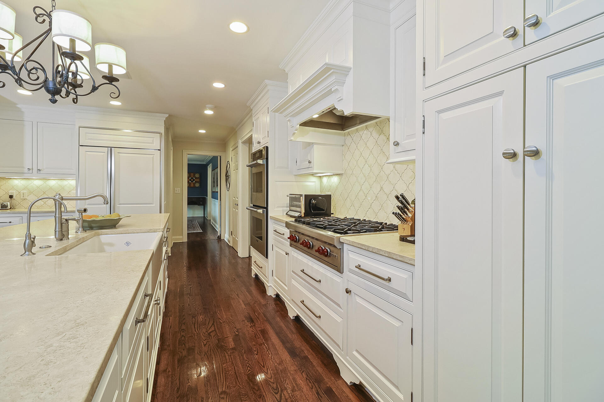 37 Red Rose Circle Darien, CT 06820 - Photo 10 of 40 a large kitchen with kitchen island a large counter space a sink appliances and cabinets