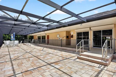 a view of a swimming pool with a patio