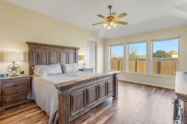 a view of a dining room and livingroom with furniture window and wooden floor
