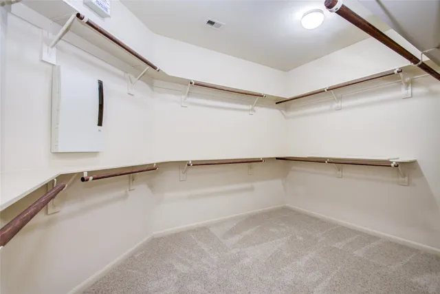 a bathroom with a tub a sink a mirror and a shower