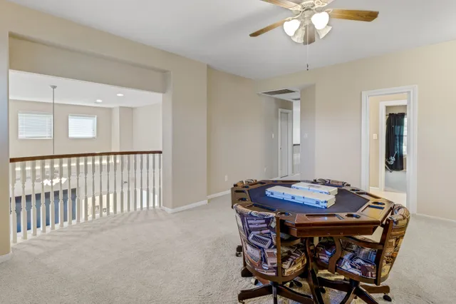 a workspace with furniture and chandelier