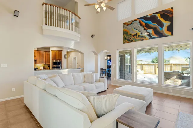 a living room with furniture fireplace and flat screen tv