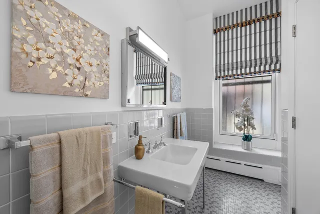 a bedroom with a large bed and a couch