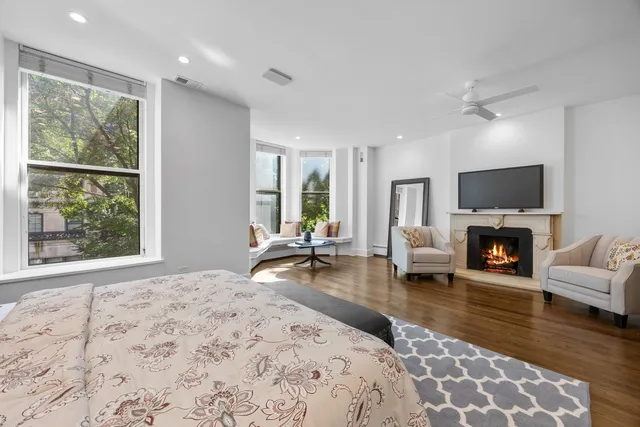 a bathroom with a double vanity sink a mirror and shower
