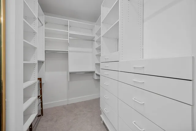 a bedroom with a bed and with furniture