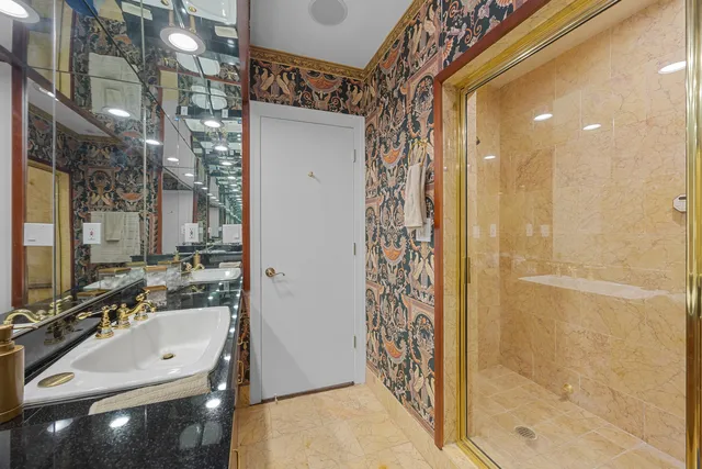 a bedroom with two beds and a couch