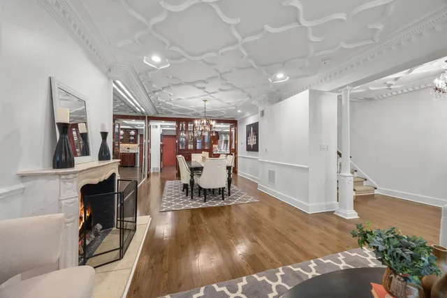 a view of a room with lots of wooden furniture and a rug