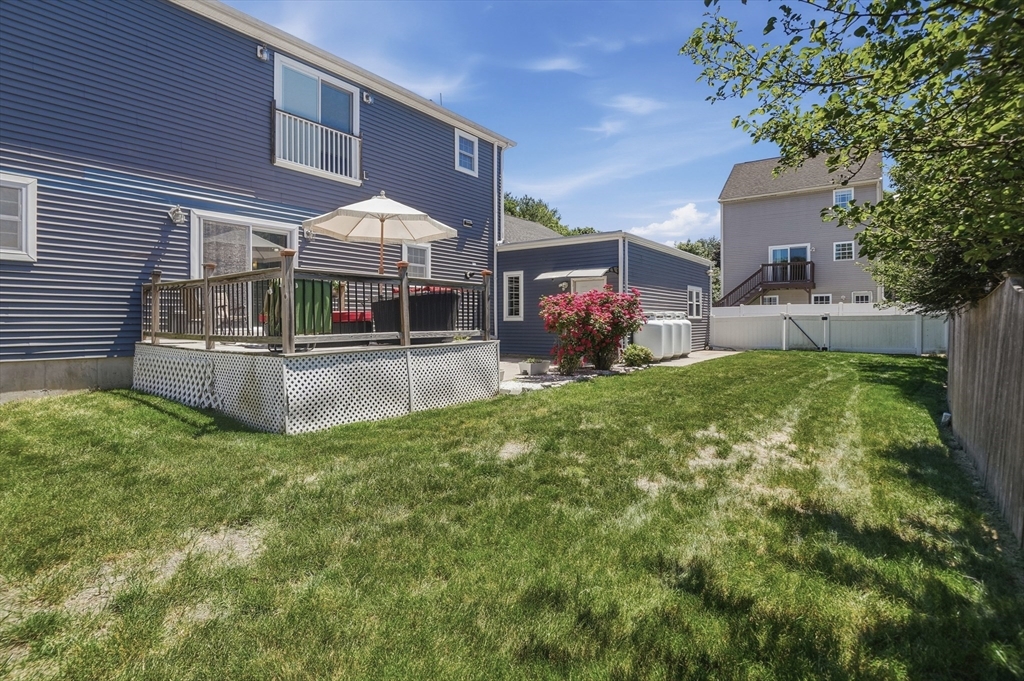112 Pineland Avenue Worcester, MA 01604 - Photo 37 of 38 a view of a house with a backyard and sitting area