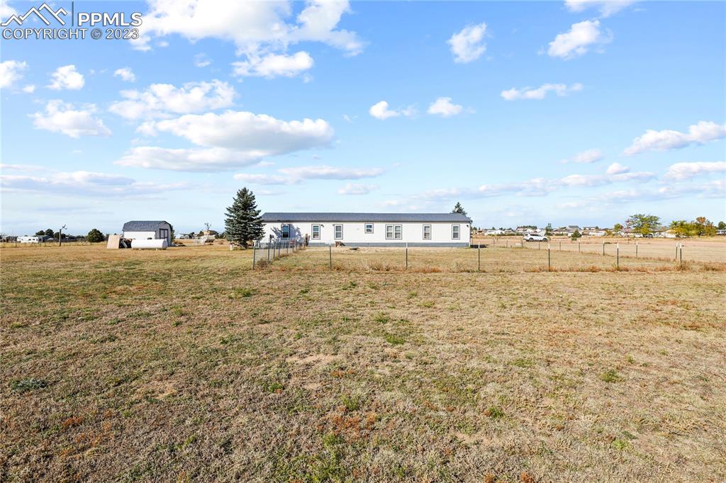 17755 Sage Crest Road Peyton, CO 80831 - Photo 33 of 37 a view of a ocean with beach