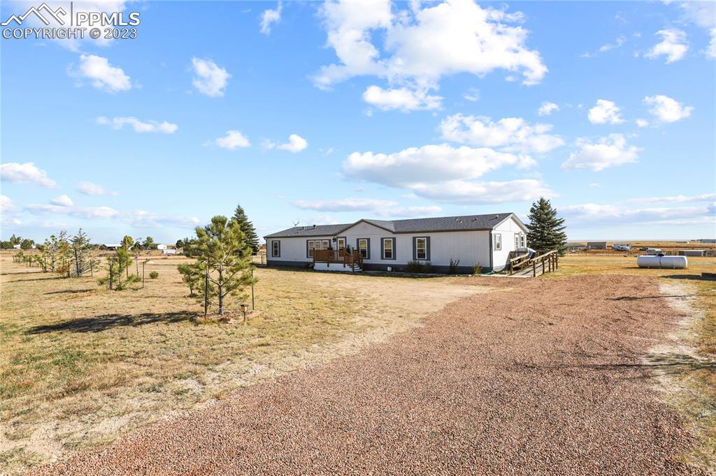 17755 Sage Crest Road Peyton, CO 80831 - Photo 4 of 37 a view of a lake with a houses