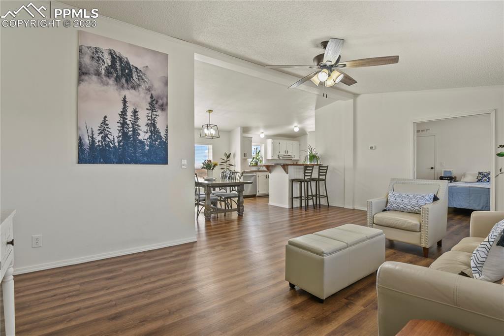 17755 Sage Crest Road Peyton, CO 80831 - Photo 8 of 37 a living room with furniture and wooden floor