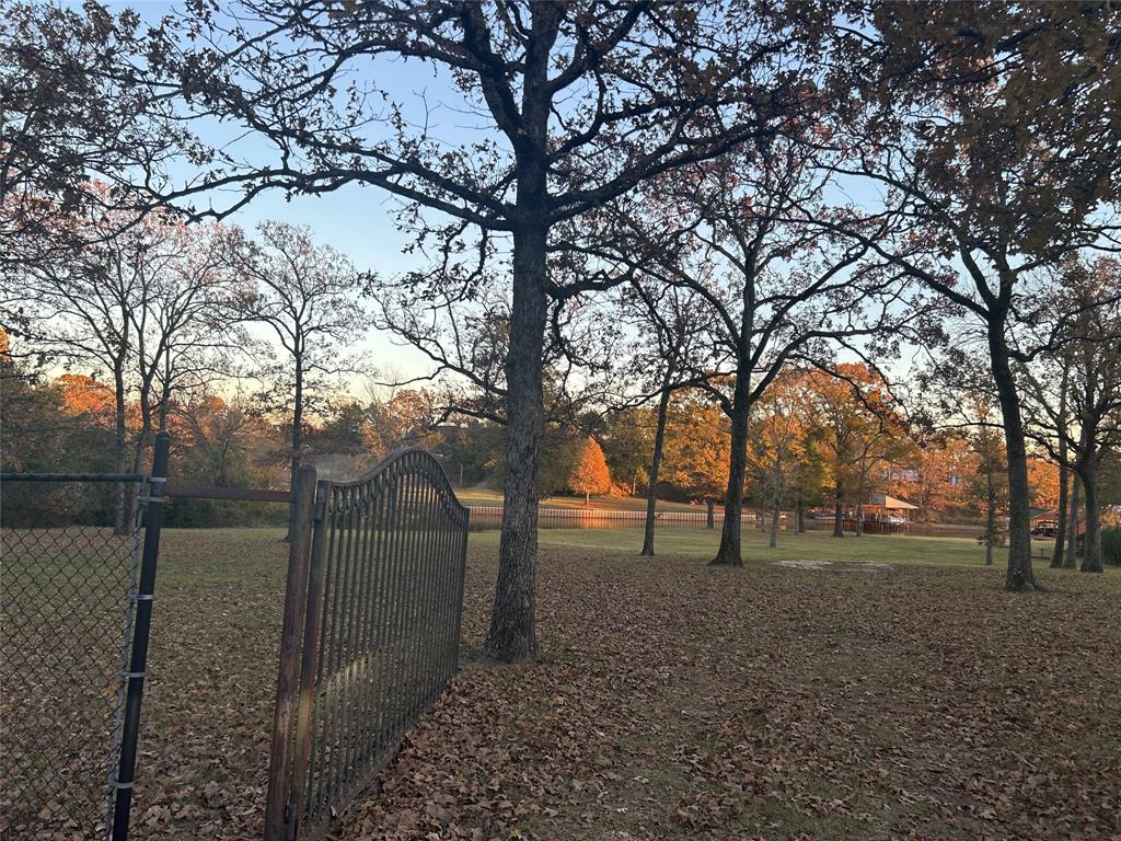15 East R E Goliad Street Log Cabin, TX 75148 - Photo 6 of 7 a view of outdoor space with tree s