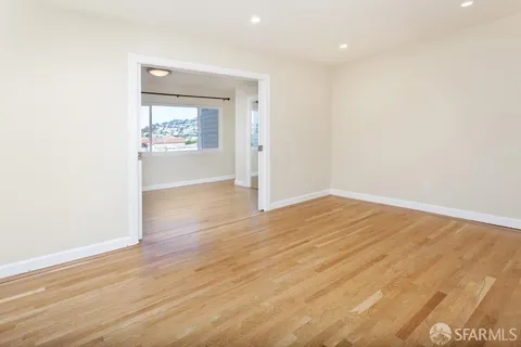 a view of a room has wooden floor