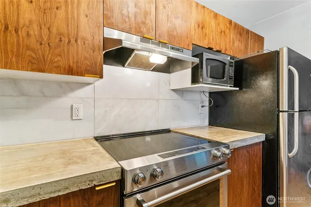 a kitchen with a stove and a microwave