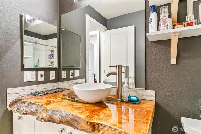 a bedroom with furniture and a window