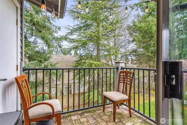 a view of a chair and table in the balcony
