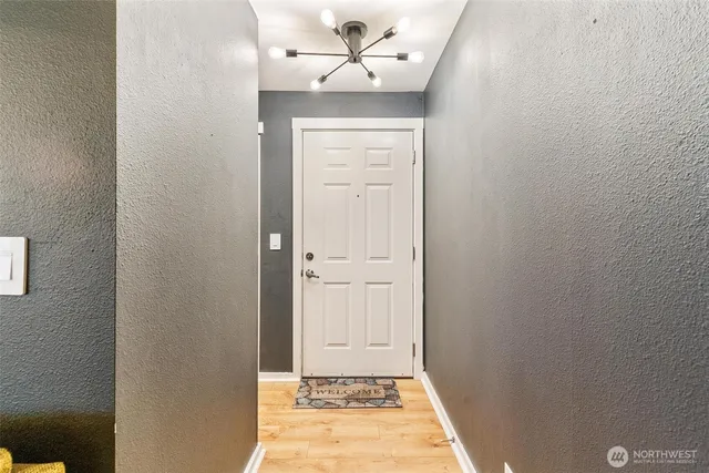 a view of a hallway with front door