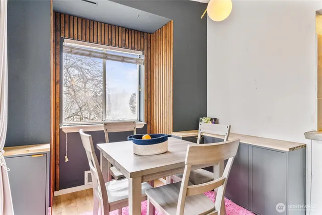 a view of a dining room with furniture window and outside view