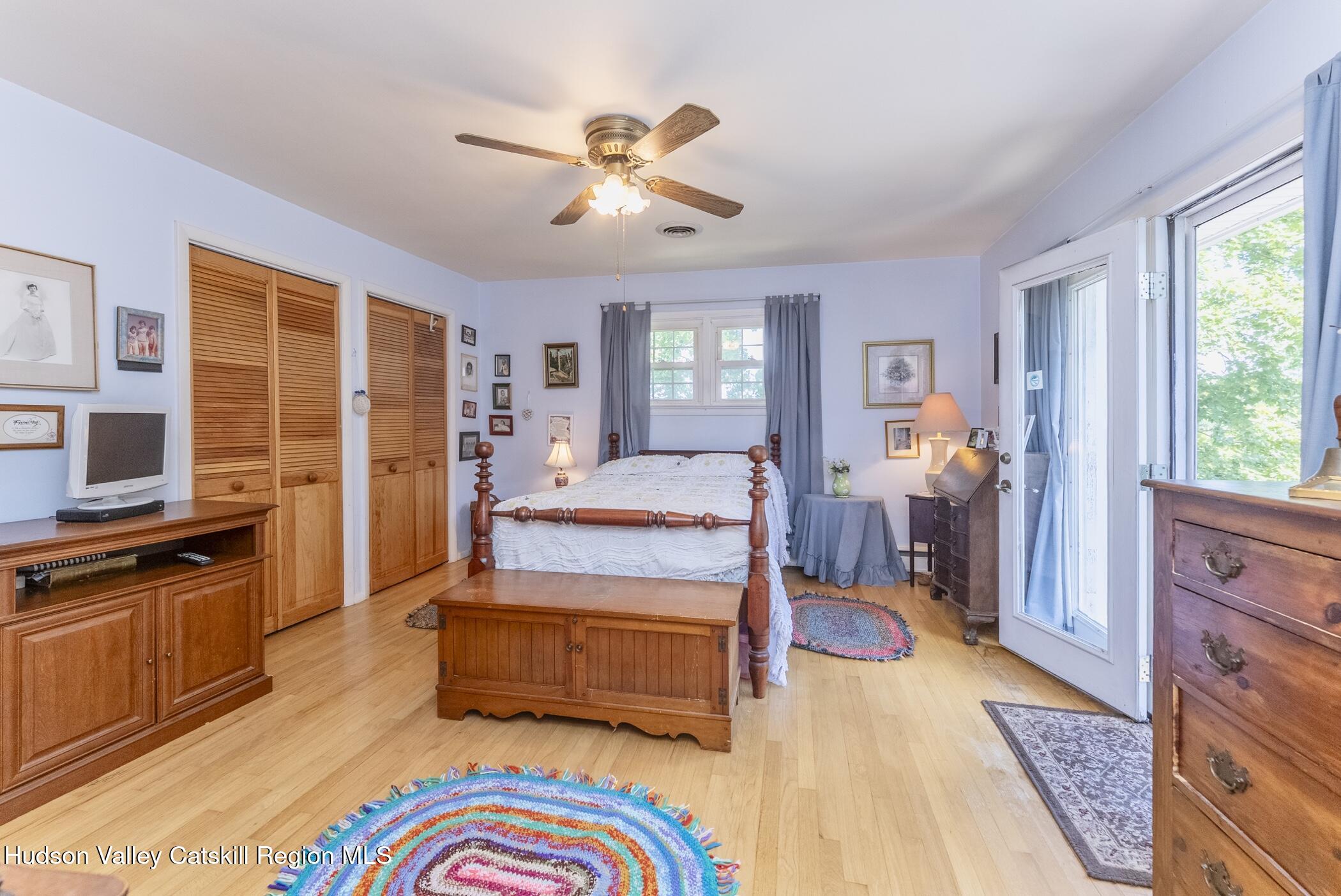 70 Ringtop Road Kingston, NY 12401 - Photo 24 of 47 a bedroom with a bed and wooden floor