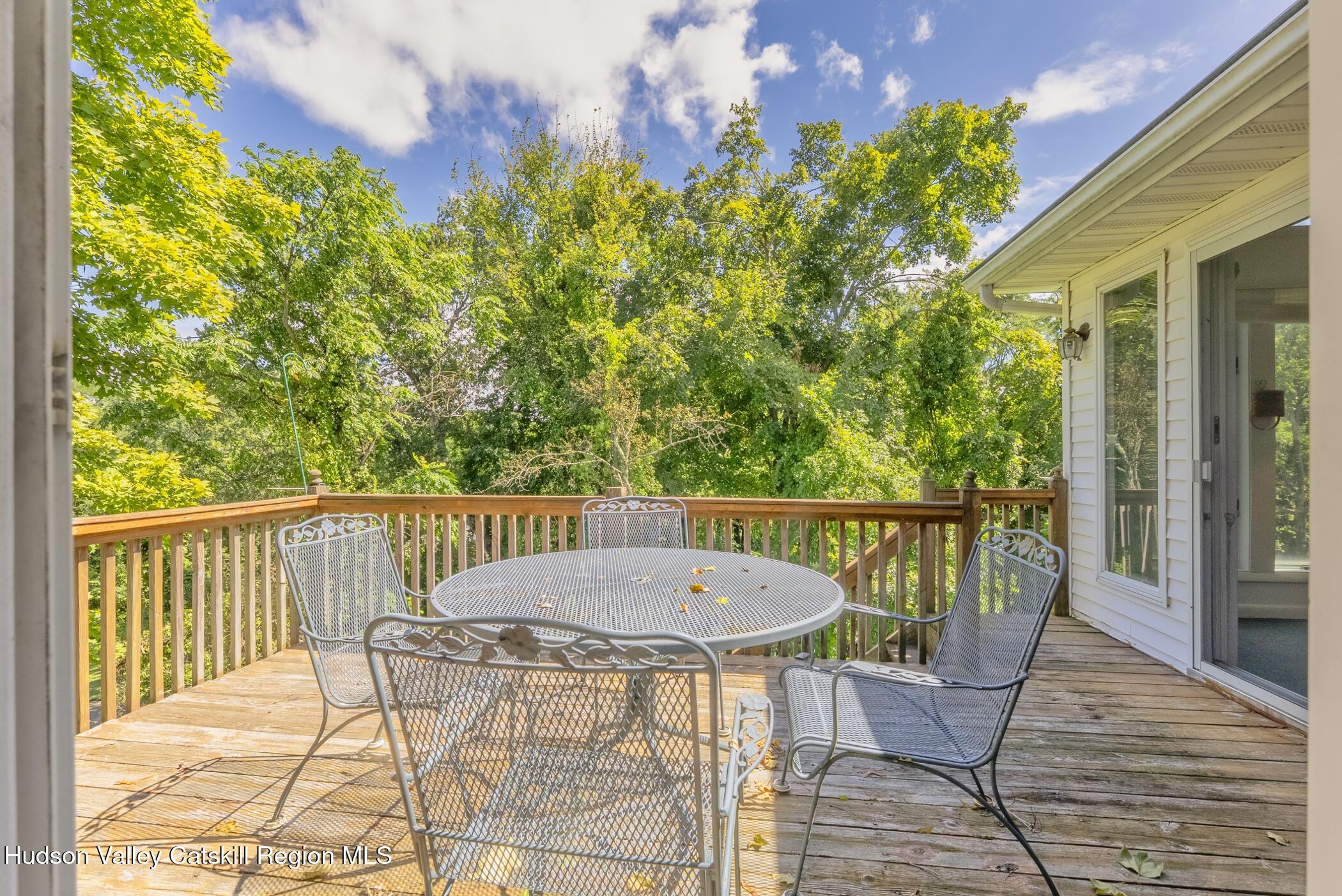 70 Ringtop Road Kingston, NY 12401 - Photo 39 of 47 a view of a balcony with table and chairs