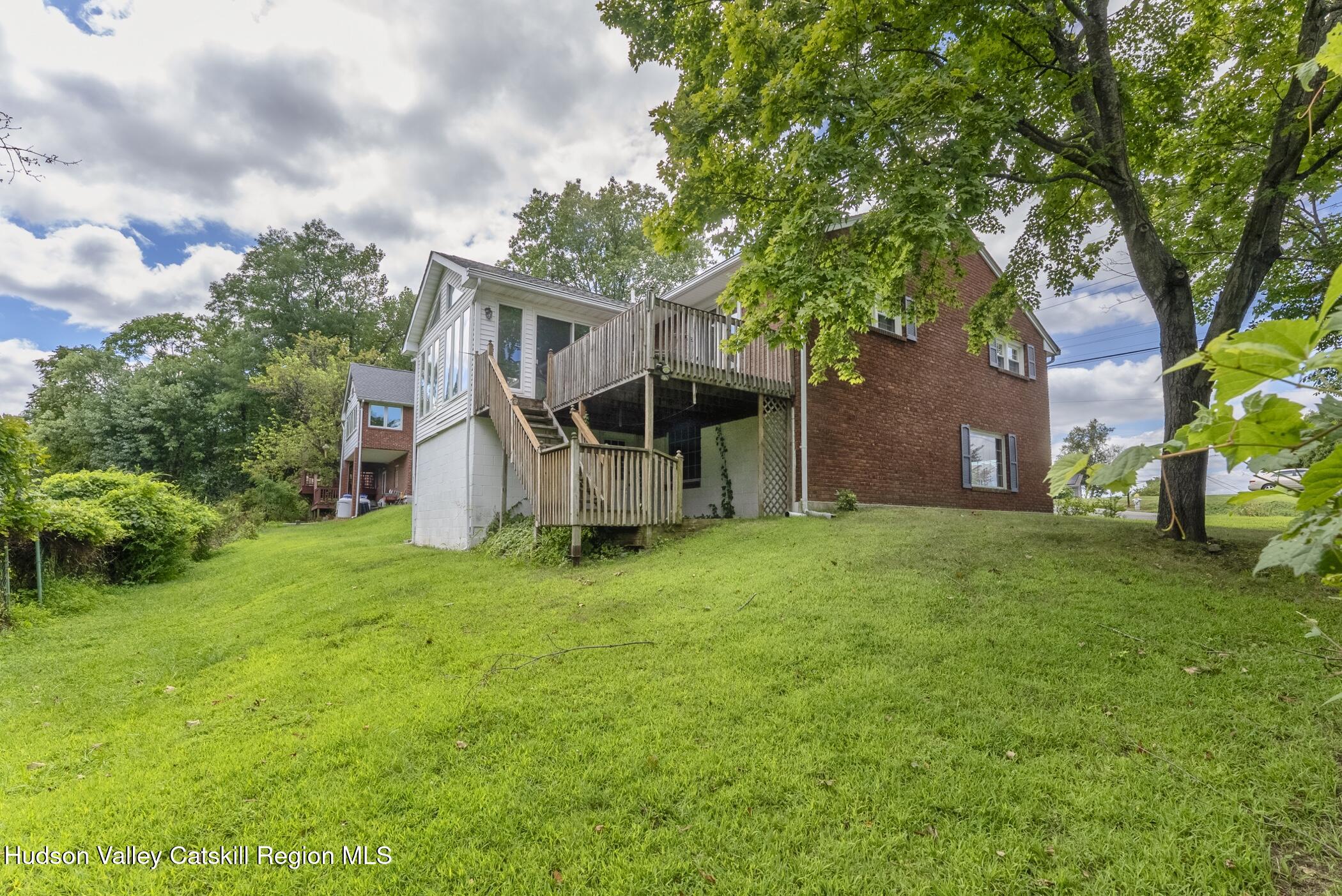 70 Ringtop Road Kingston, NY 12401 - Photo 43 of 47 a view of a house with backyard and a tree