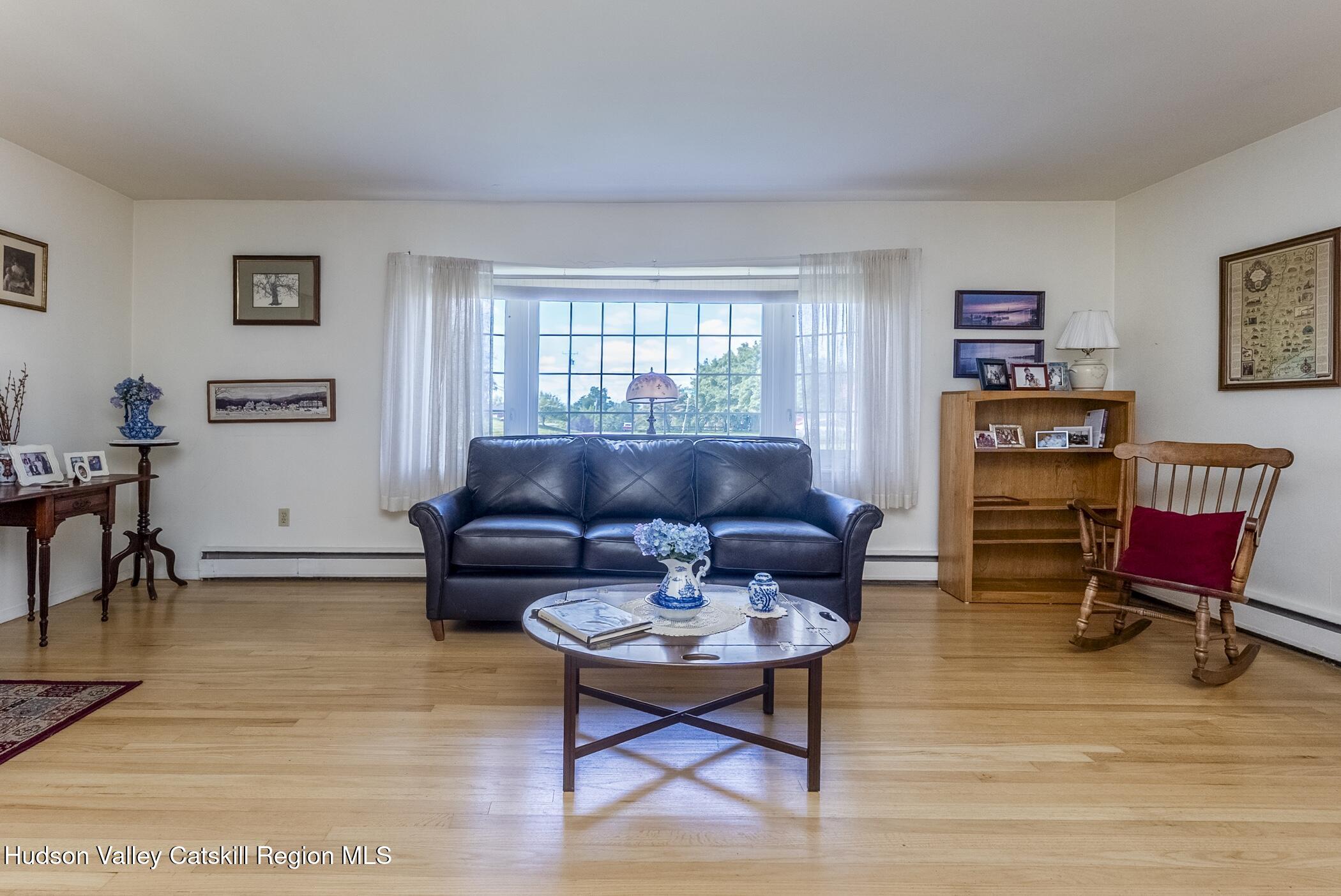 70 Ringtop Road Kingston, NY 12401 - Photo 7 of 47 a living room with furniture and a wooden floor