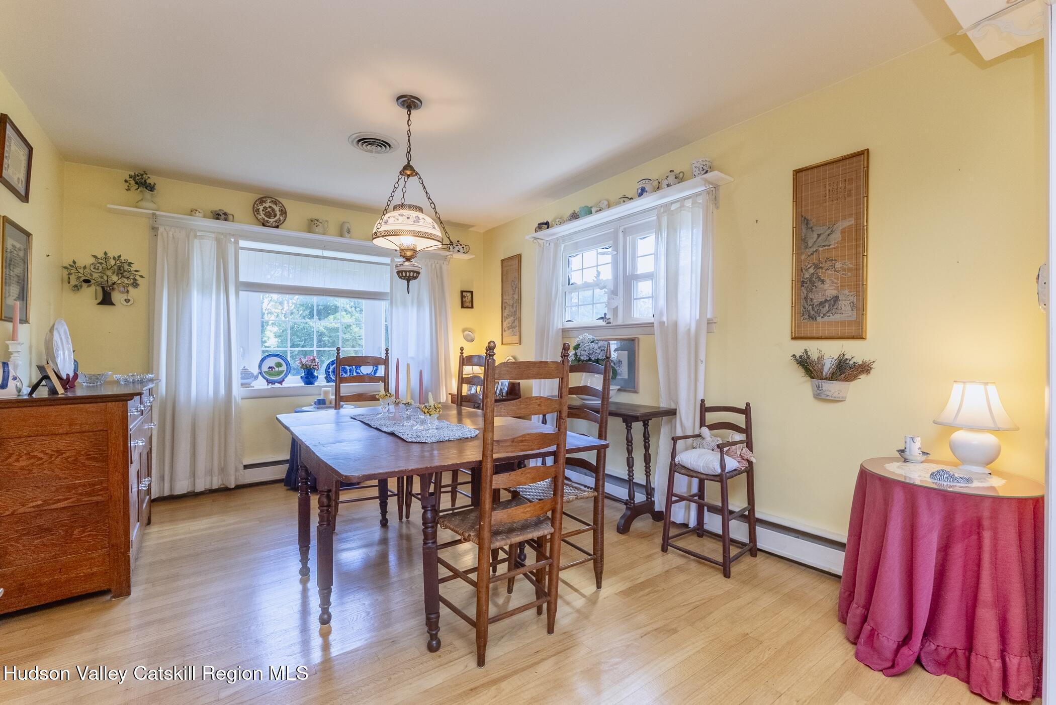 70 Ringtop Road Kingston, NY 12401 - Photo 10 of 47 a view of a dining room with furniture window and wooden floor