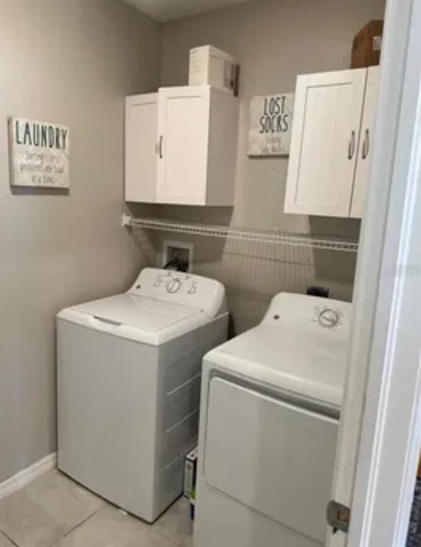 9317 Lemon Drop Loop Ruskin, FL 33573 - Photo 5 of 13 a utility room with dryer and washer