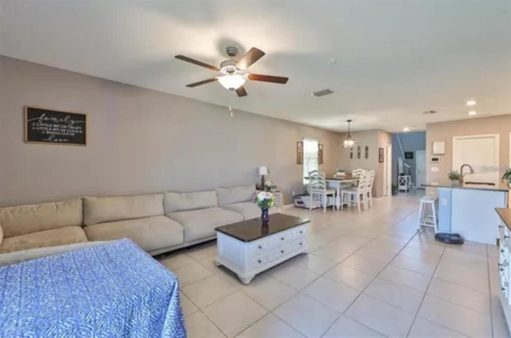 9317 Lemon Drop Loop Ruskin, FL 33573 - Photo 8 of 13 a living room with furniture and a view of living room
