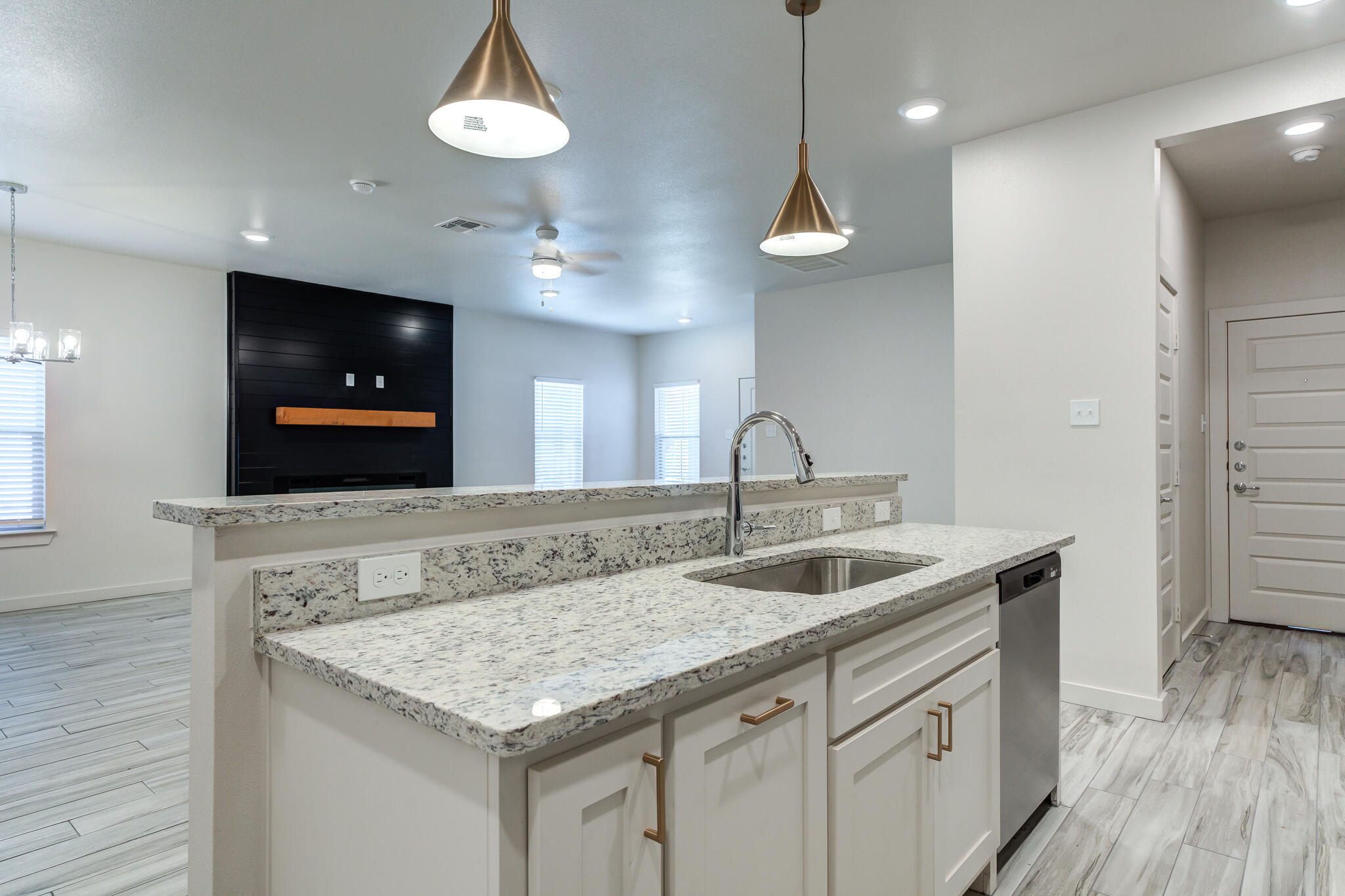 7044 41st Street Lubbock, TX 79407 - Photo 12 of 22 a kitchen with a stove and a sink