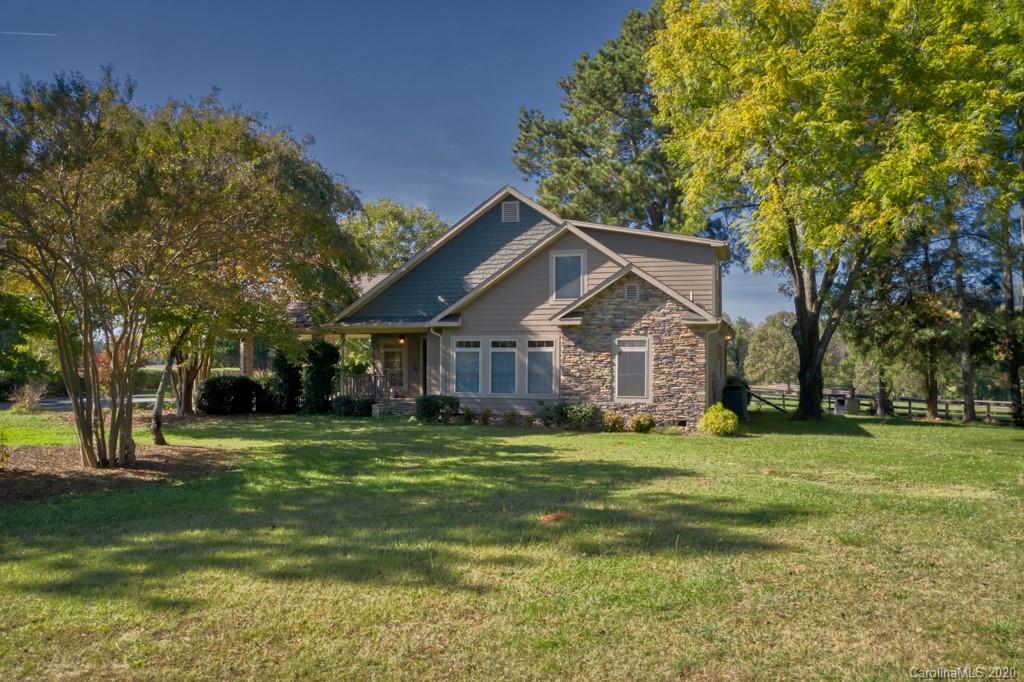 475 Gilbert Road Columbus, NC 28722 - Photo 1 of 45 a front view of a house with a yard