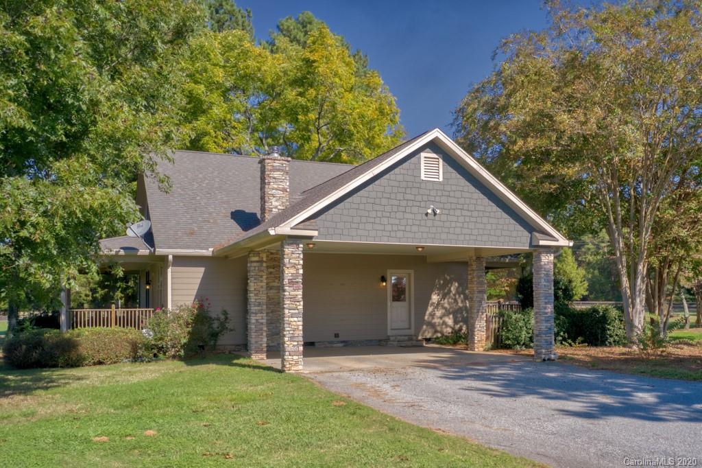 475 Gilbert Road Columbus, NC 28722 - Photo 2 of 45 a front view of a house with a yard