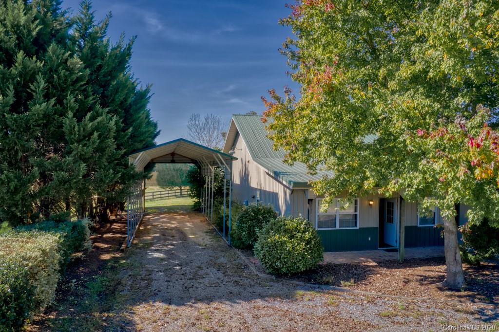475 Gilbert Road Columbus, NC 28722 - Photo 12 of 45 a front view of a house with garden