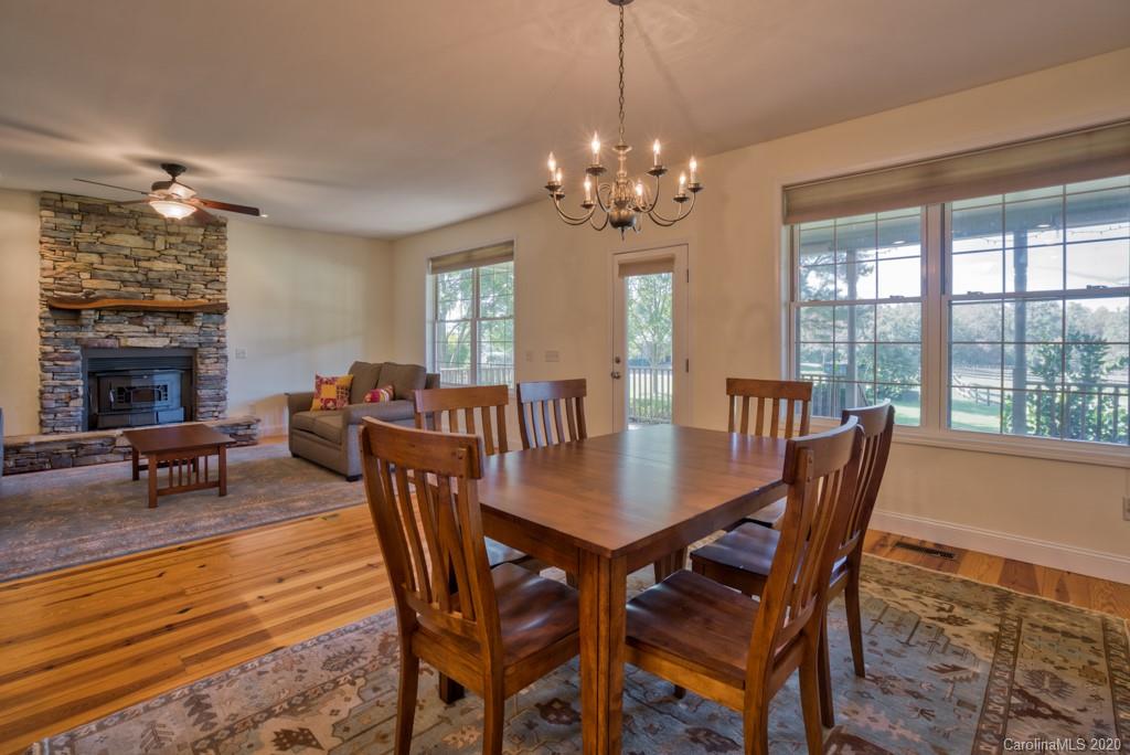 475 Gilbert Road Columbus, NC 28722 - Photo 18 of 45 a view of a dining room with furniture window and wooden floor