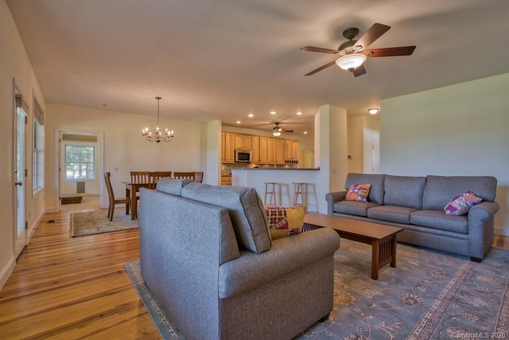 475 Gilbert Road Columbus, NC 28722 - Photo 19 of 45 a living room with furniture and a chandelier