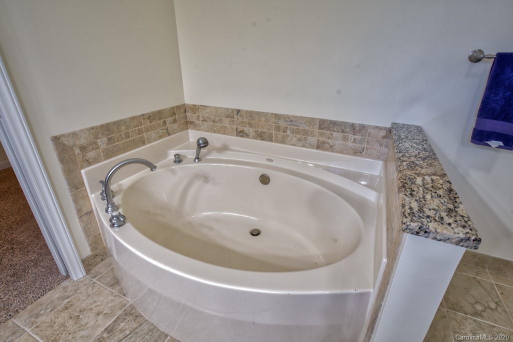 475 Gilbert Road Columbus, NC 28722 - Photo 23 of 45 a bath tub sitting in a bathroom