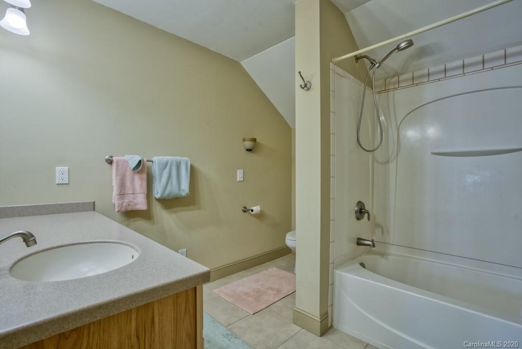 475 Gilbert Road Columbus, NC 28722 - Photo 29 of 45 a bathroom with a sink and a mirror