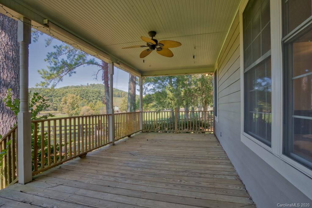 475 Gilbert Road Columbus, NC 28722 - Photo 31 of 45 a view of a porch with wooden floor and outdoor space