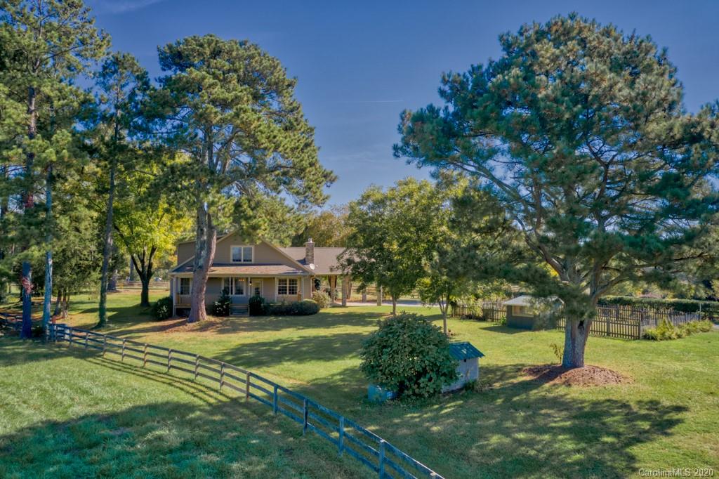 475 Gilbert Road Columbus, NC 28722 - Photo 5 of 45 a house view with a garden space