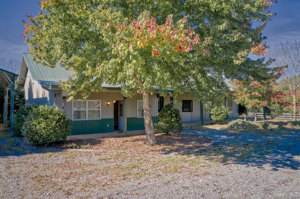 475 Gilbert Road Columbus, NC 28722 - Photo 6 of 45 a front view of a house with garden
