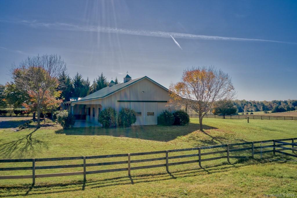 475 Gilbert Road Columbus, NC 28722 - Photo 8 of 45 a view of a house with a yard