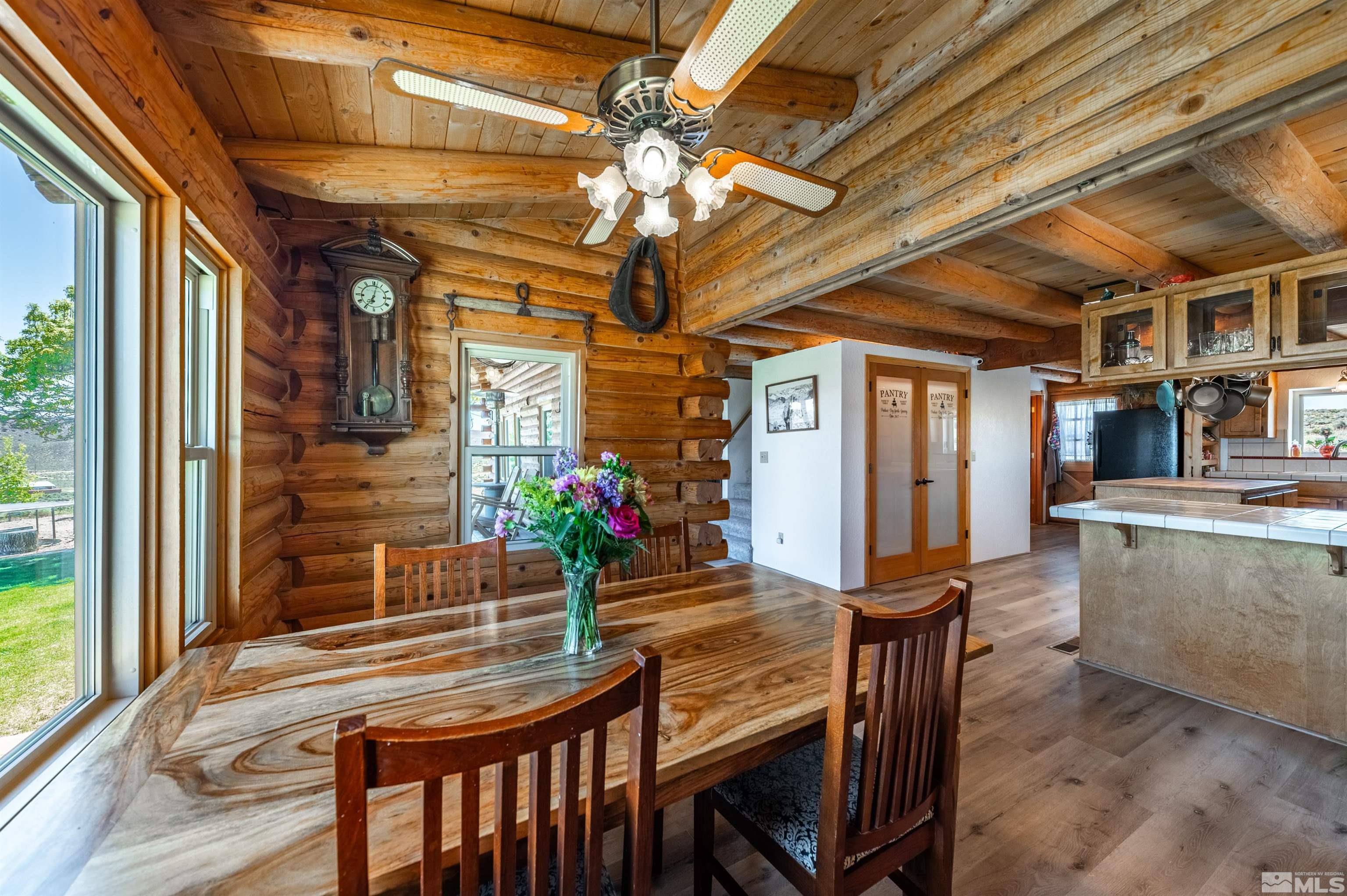6105 Anniversary Road Reno, NV 89510 - Photo 9 of 40 a view of a dining room with furniture and a chandelier