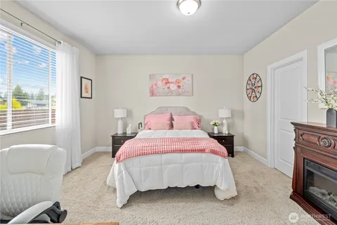 a bedroom with a bed and a couch