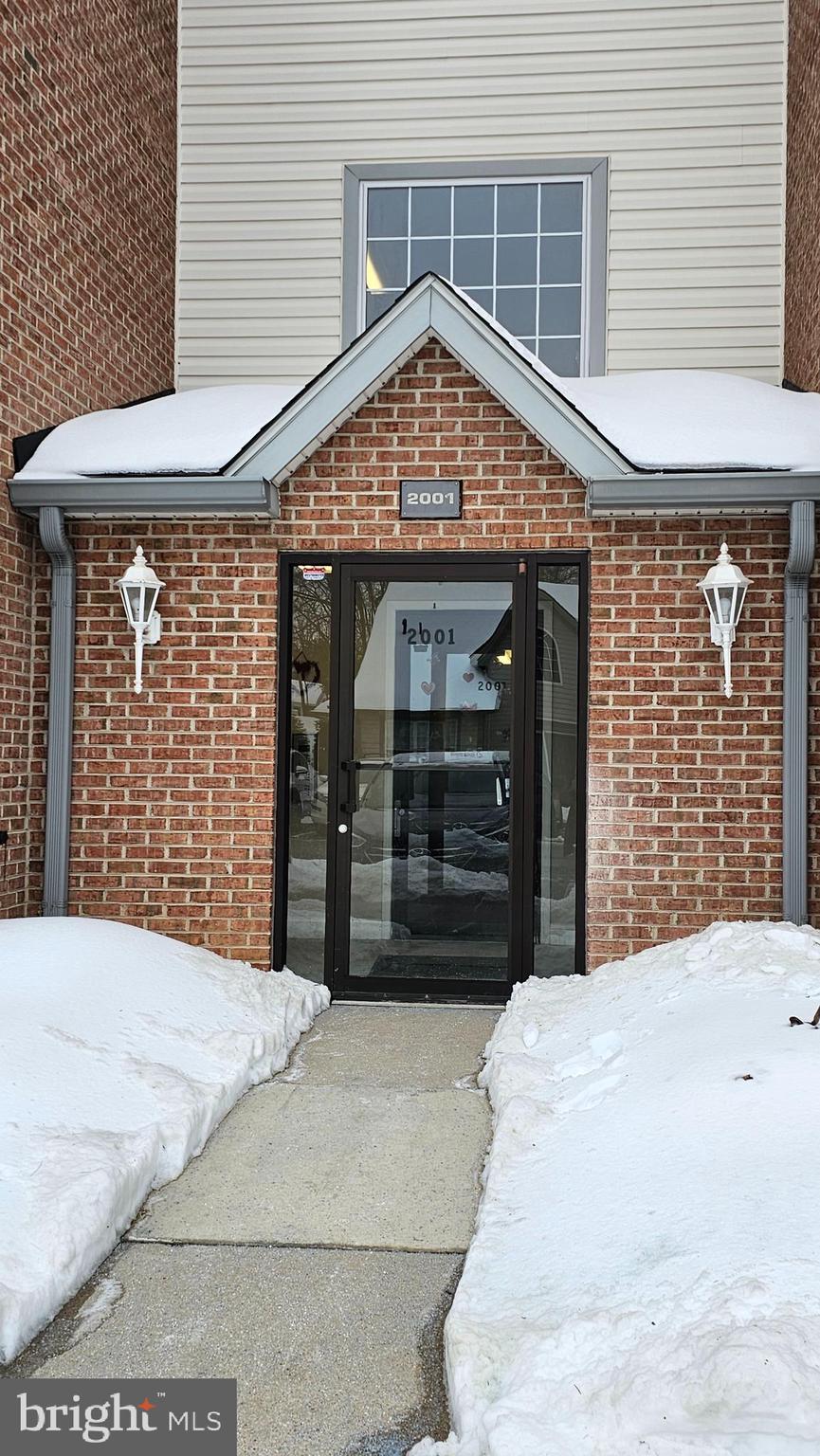 2001 Rudy Serra Drive, Unit 1B Sykesville, MD 21784 - Photo 28 of 28 a view of a house with a garage