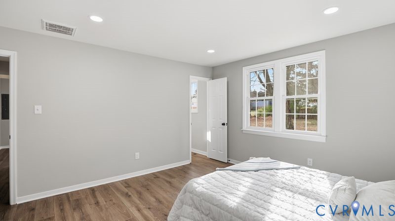 25209 Ritchie Avenue Petersburg, VA 23803 - Photo 27 of 50 a spacious bedroom with a bed and a window